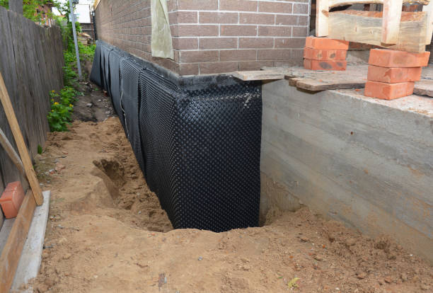 Happy homeowners after waterproofing job in Glenbeulah
